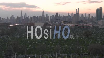 Aerial Of Vast Cemetery In New York City Suggests Victims From Coronavirus Covid-19 Pandemic Epidemic Outbreak Deaths. - Video Drone Footage