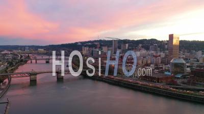Very Good Dusk Aerial Of Downtown Portland Oregon, Willamette River, Skyline, Stag Sign, Bridges, And Old Town. - Video Drone Footage