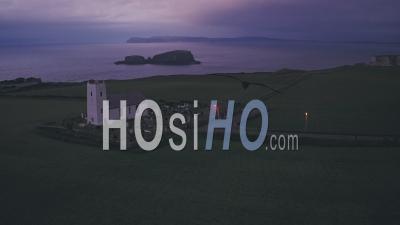 Church At Night On The Antrim Coast Of Northern Ireland. Aerial Drone View