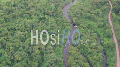 River Through Rainforest At Arenal Volcano National Park, Costa Rica. High Aerial Drone View