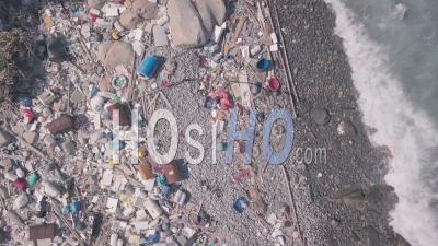 Environmental Issues Shown By Beach Covered In Plastic And Rubbish In Hong Kong. Static Aerial Drone View