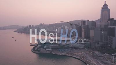 Hong Kong Harbour And Downtown City Centre Sunrise. Aerial Drone View At Sunrise