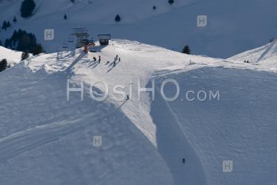 Skiers Skiing On Ski Slopes In The Ski Resort Area Of Avoriaz In The Alps Mountains, France, Europe