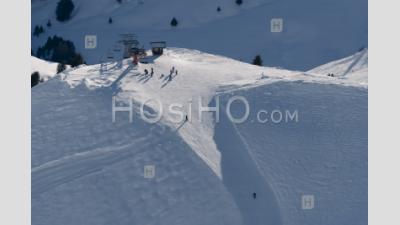 Skiers Skiing On Ski Slopes In The Ski Resort Area Of Avoriaz In The Alps Mountains, France, Europe