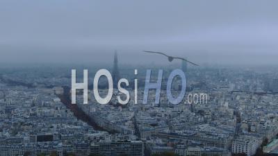 Aerial Footage Of Paris And Eiffel Tower Under A Cloudy Sky, Seen From Helicopter