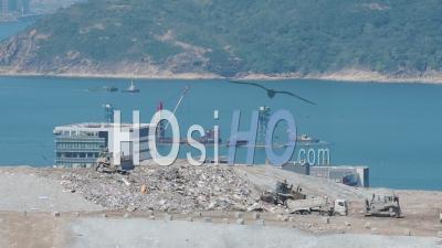 Climate Change Emergency. Landfill Tip Causes Environmental Destruction On Coast In Hongkong - Drone Shot