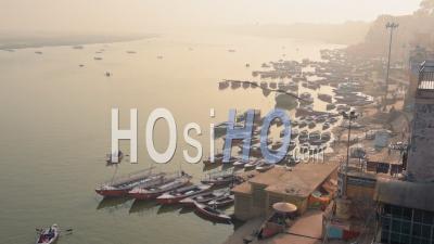 An Array Of Boats Docked On The Port Of The River Ganges Located In Varanasi, Uttar Pradesh, India. -Aerial Shot