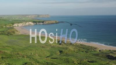 The Beautiful Waves Of The Antrim Coast Rolling To The Beach Of Ireland - Wide Shot