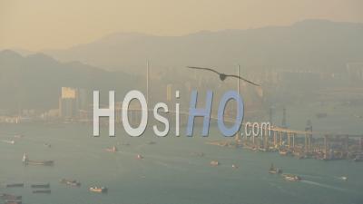 Shipping Vessels Sailing Across The Sea On A Foggy Morning In Hong Kong - Wide Shot