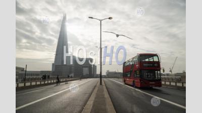 Quiet, Empty And Deserted Roads And Streets In London In Coronavirus Covid-19 Pandemic Lockdown At The Shard At London Bridge With Red London Bus In England, Uk, Europe