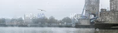 Tower Of London And Tower Bridge On A Misty Atmospheric Morning With Fog And Mist On The River Thames On Coronavirus Covid-19 Lockdown Day One In Thick Foggy Weather, City Of London, England, Uk