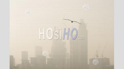 Construction Background With Copy Space, London Cityscape With Tall Skyscrapers, Office Blocks And Apartments, Misty Orange City Buildings In England, Uk, Europe
