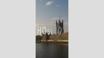 Vertical Video Of Timelapse Of London River Thames And Houses Of Parliament, The Iconic Building, Time Lapse Of Clouds Moving In Bright Blue Sky, Shot In Coronavirus Covid-19 Lockdown In England, Uk