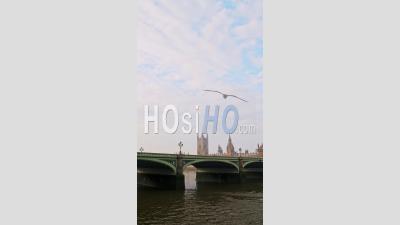 Vertical Video Of River Thames And Westminster Bridge In London In Coronavirus Covid-19 Lockdown, Showing Quiet, Empty Iconic Famous Building And Tourist Attraction In England, Uk