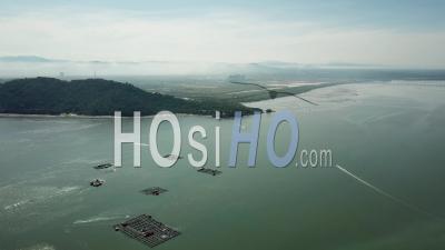 Aerial View Fishing Boat Move Near The Fish Farm And Jetty Batu Musangn - Video Drone Footage