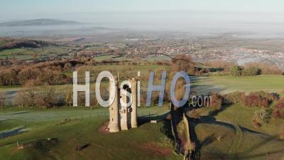 Aerial Drone Video Of Broadway Tower, A Famous Iconic Tourist Attraction In The Cotswolds Hills, Iconic English Landmark With Beautiful Misty British Countryside Scenery, Gloucestershire, England, United Kingdom