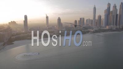 Boat At Sea With Dubai Marina Skyline - Video Drone Footage