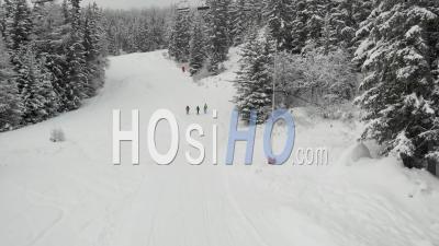 Skiers Walking On A Slope And Closed Ski Lift During Covid 19 - Video Drone Footage