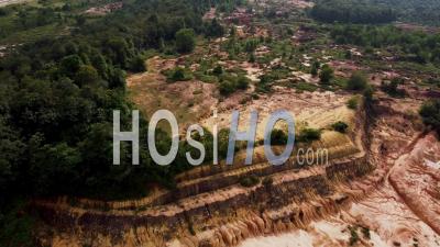 Yellow Soil At Land After The Green Trees Is Cut Down - Video Drone Footage