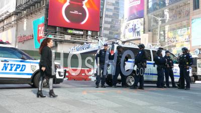 A Group Of Police Officers Gather In Times Square