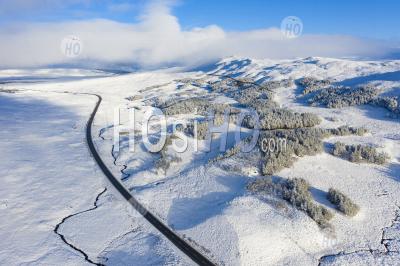  Aerial View Of A82 Road Passing Over Snow Covered Rannoch Moor In Winter, Scotland, Uk - Aerial Photography