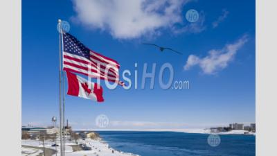 Us And Canadian Flags At Border Crossing - Aerial Photography