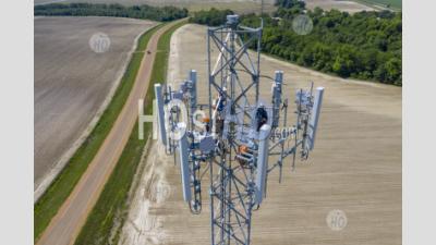 Workers On Cell Phone Tower - Aerial Photography