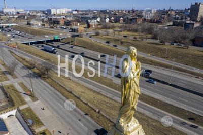 Statue Of Mary On Church Steeple - Aerial Photography