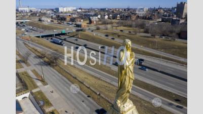 Statue Of Mary On Church Steeple - Aerial Photography