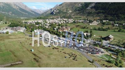 Agricultural Fair In The Village Of Monetier-Les-Bains, Hautes-Alpes, France, Viewed From Drone