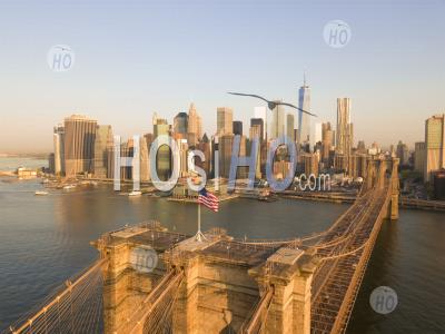 Brooklyn Bridge Aerial View With American Flag Waving And Manhattan Skyline In The Background In Daylight Hq - Aerial Photography