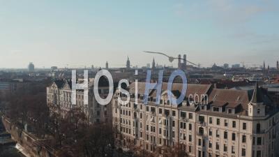 Above The Rooftops Of Beautiful Luxury Old Building With Apartments By Isa Riverside In Munich, Germany On Winter Sunny Day, Epic Aerial Dolly Forward - Video Drone Footage