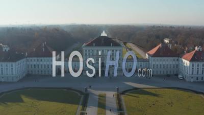 Amazing Royal Palace With Green Grass Lawn Of Nymphenburg Palace Schloss Nymphenburg In Munich, Germany From Aerial Drone Perspective