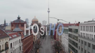 Aerial Slow Flight Through Empty Central Berlin Neighbourhood Street With Cathedrals And View On Alexanderplatz Tv Tower During Coronavirus Covid 19 On Overcast Cloudy Day - Video Drone Footage