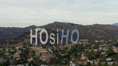 Griffith Observatory Far Away With View On Hollywood Hills In Daylight, Los Angeles, California, Cloudy 4k - Video Drone Footage