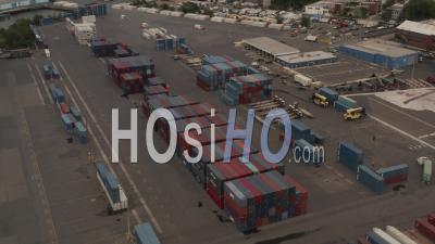 Aerial View Closing Up On The Container Trucks With Trailers In The Container Terminal In New York City 4k - Video Drone Footage