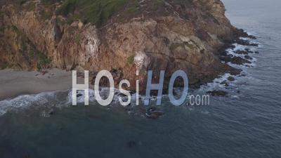 Flight Over Malibu, California View Of Beach Shore Line Pacific Ocean At Sunset With Mountain Cliff In Beautiful 4k - Video Drone Footage