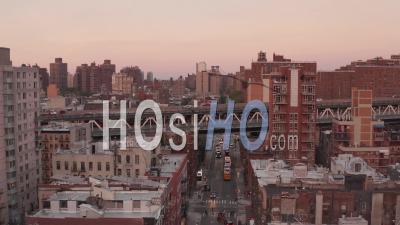 Aerial View Following Cars Driving On The Overpass Above Residential Buildings In Chinatown Towards Manhattan Bridge 4k - Video Drone Footage