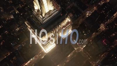 Epic Close Up Heli Shot Of Empire State Building Above Lit Up Parallel Avenues And Junctions Residential Condominiums And Office Buildings In Midtown Manhattan, New York City At Night 4k - Video Drone Footage
