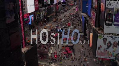 Slow Dolly Aerial View Of Busy Crowds And Yellow Taxis At The Times Square Intersection In New York City 4k - Video Drone Footage