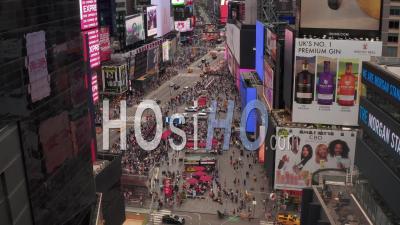 Aerial Pedestal Rising Shot Of Times Square In New York City With Crowds Of People And City Traffic 4k - Video Drone Footage