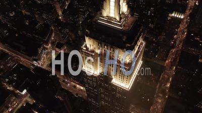 Breathtaking Circle Over The Iconic Empire State Building Above Lit Up Parallel Avenues And Junctions Residential Condominiums And Office Buildings In Midtown Manhattan, New York City Night 4k - Video Drone Footage