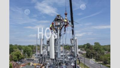 Workers Upgrade Cell Tower - Aerial Photography