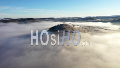 Aerial View Of Hills In Mystic Morning Haze And Clouds - Video Drone Footage