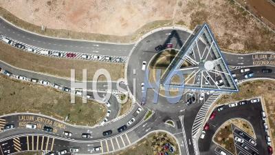 Car Slowly Enter Roundabout With Ikea Signboard - Video Drone Footage