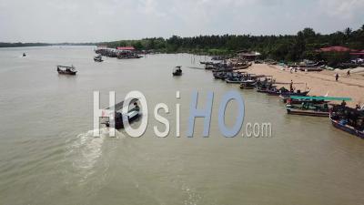 Aerial A Boat Arrive The Jetty Kuala Muda - Video Drone Footage