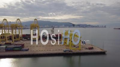 Lorry Ship The Container To The Ship At Container Terminal - Video Drone Footage