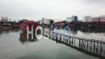 Fly Toward Red Temple At Wooden Still Bridge At Tan Jetty - Video Drone Footage