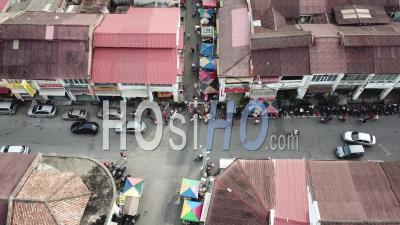 Aerial Traffic Of Crowd And Vehicles In Lively Morning Market At Georgetown - Video Drone Footage