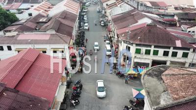 Hawkers Sell Food At Crossroads At Lebuh Kimberly And Jalan Kuala Kangsar. - Video Drone Footage